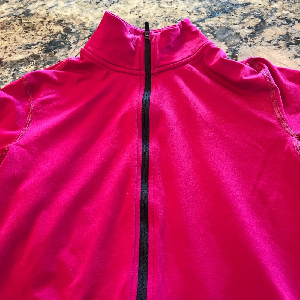 Nike Dri-fit pullover .Fuchsia size Med. Thumb holes. Good condition